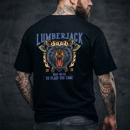 Man wearing a black t-shirt with a bear graphic and text on the back, against a dark background.