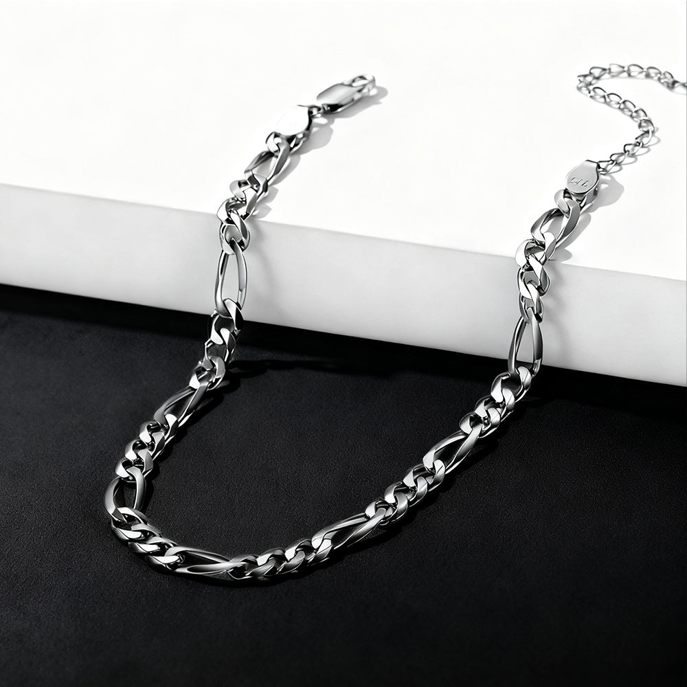 Silver chain bracelet on a white and black background
