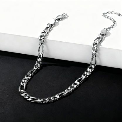 Silver chain bracelet on a white and black background