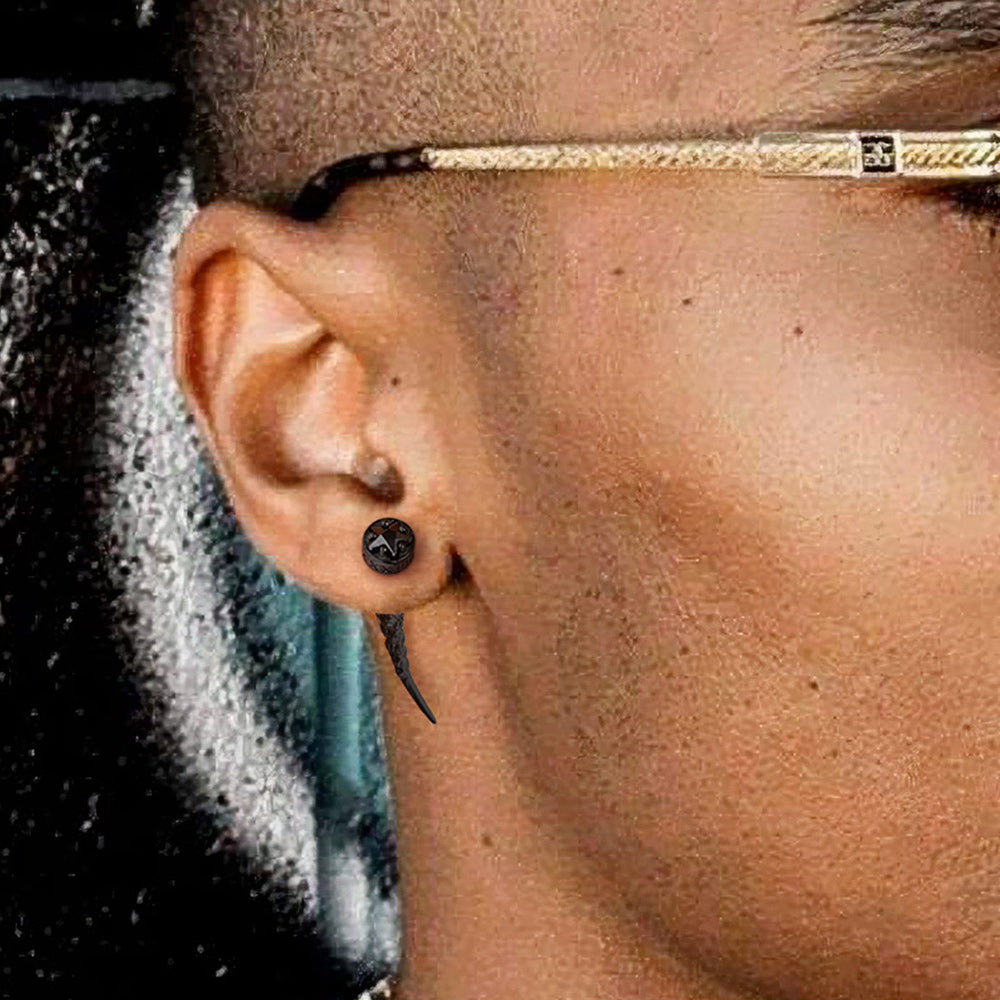 Close-up of an ear with a Nordic Star Rune Fang Stud Earrings