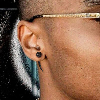 Close-up of an ear with a Nordic Star Rune Fang Stud Earrings