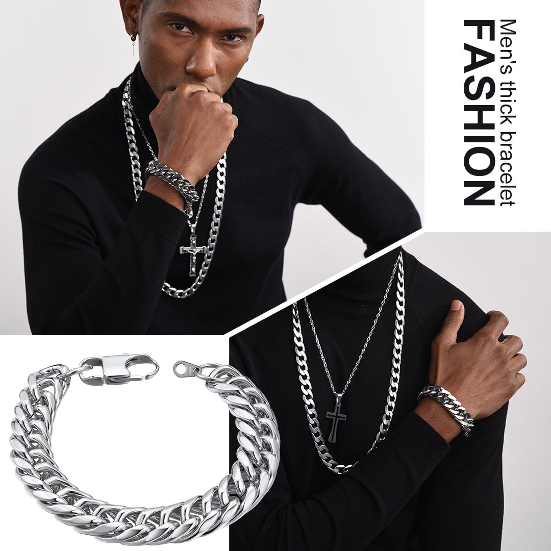 Man wearing multiple silver bracelets and necklaces with a focus on men's fashion jewelry.