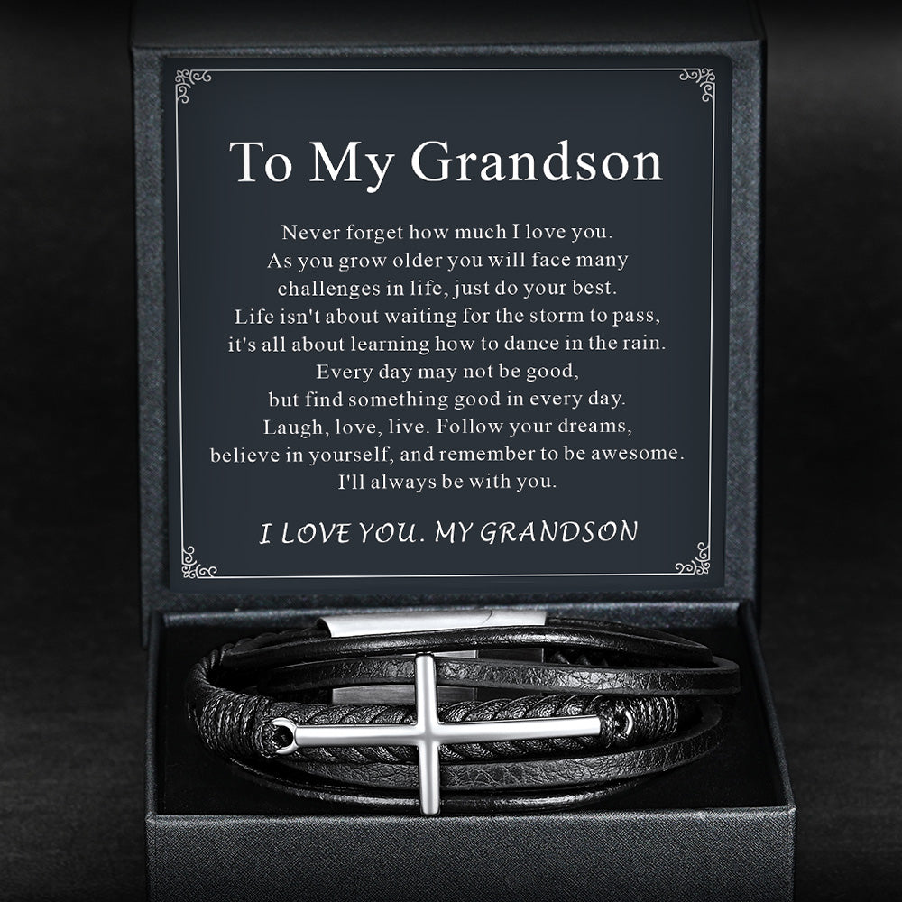leather Bracelet with cross design in a box with a message to grandson on a dark background