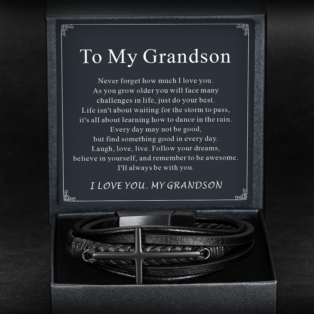 Black box with a bracelet and a message card inside on a dark background