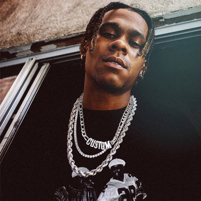 Man wearing a black shirt with a graphic design and 8MM Custom Name Chain Necklace