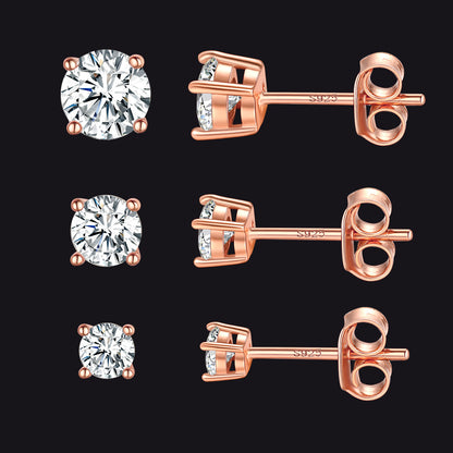 Rose gold diamond stud earrings on a black background