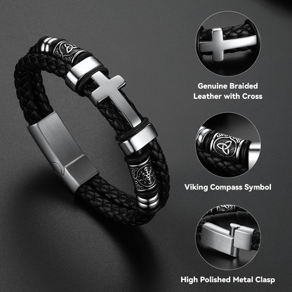 Celtic knot cross bracelet craftsmanship close-up – detailed engraving on stainless steel cross and braided leather texture
