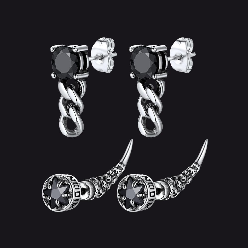 Pair of silver chain earrings with black gemstones on a black background