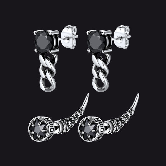 Pair of silver chain earrings with black gemstones on a black backgroundimg