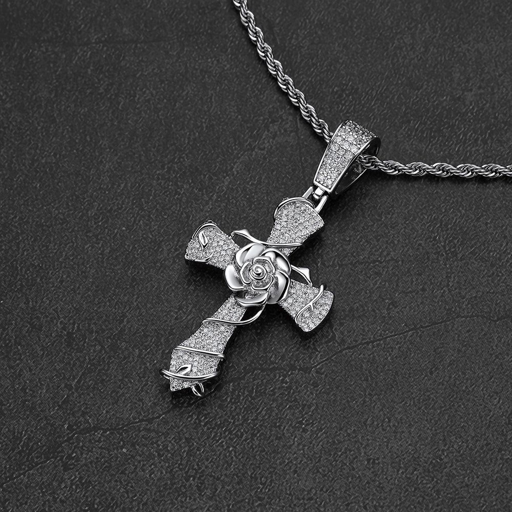 Close-up of CZ stones and thorned rose vine on crucifix cross pendant