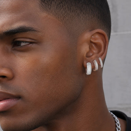 Man styling CZ hoop earrings with chain necklace, hip hop bling jewelry look for men