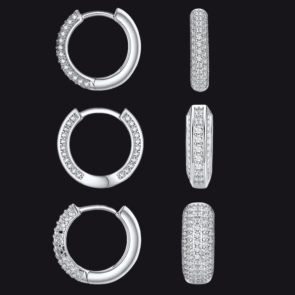 Three pairs of silver hoop earrings with pavé-set clear stones