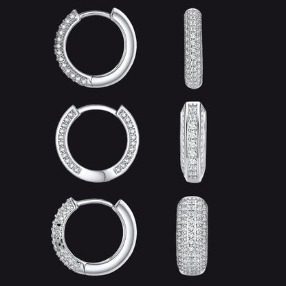 Three pairs of silver hoop earrings with pavé-set clear stones