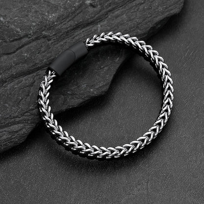 Front and side view of curb chain leather bracelet, stainless steel links with braided leather wristband
