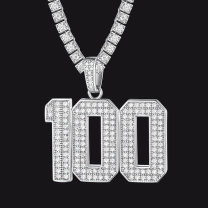 Diamond-encrusted '100' pendant on a chain against a black background