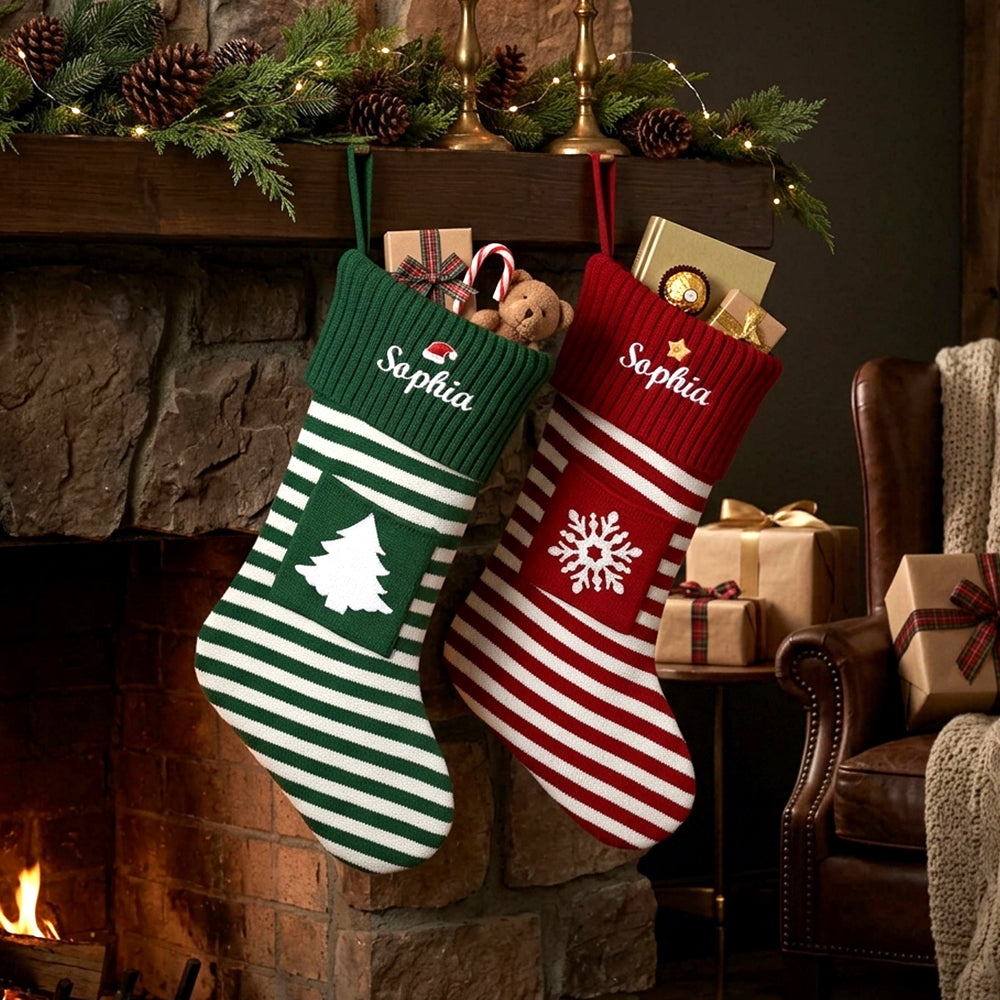 Two personalized Christmas stockings hang from a fireplace mantel in a cozy living room. 
