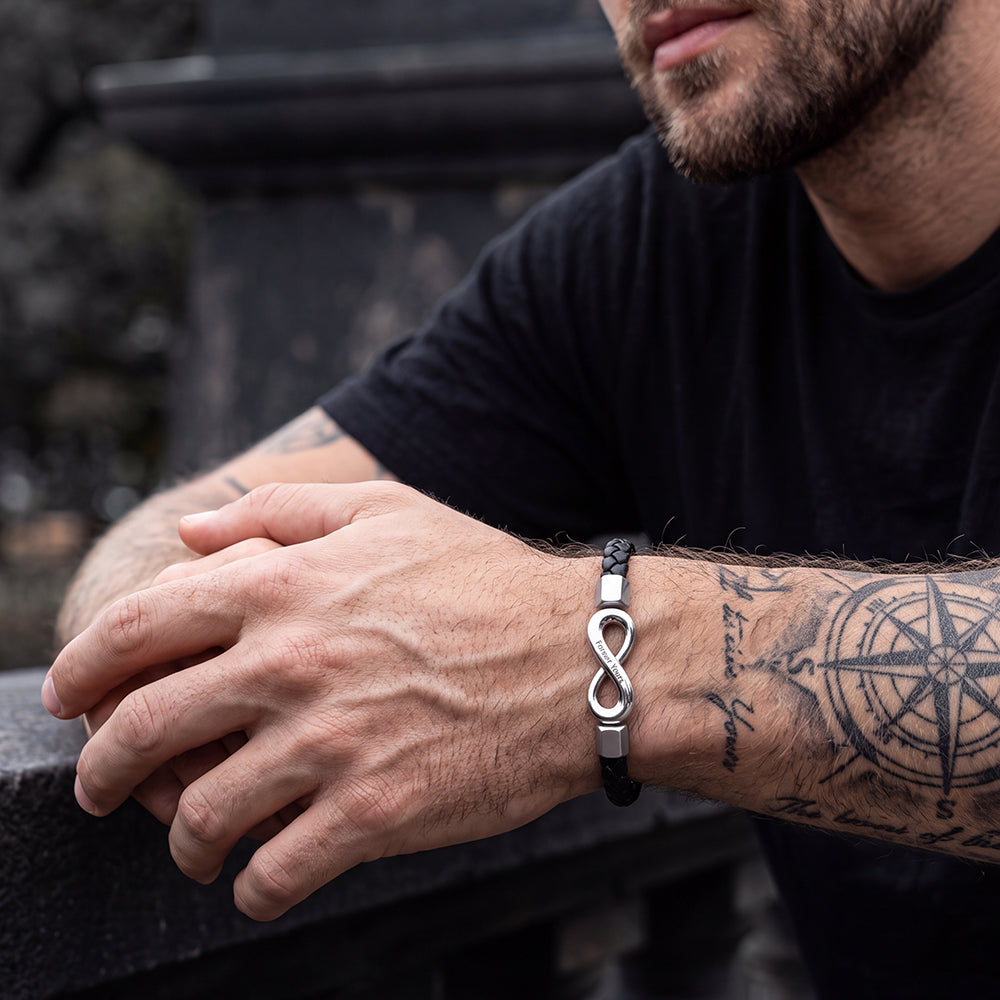 Man wearing custom engraved infinity leather bracelet on wrist