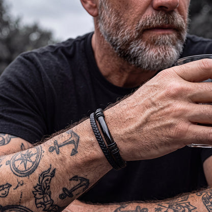Man wearing custom engraved multi-layered leather bracelet on wrist
