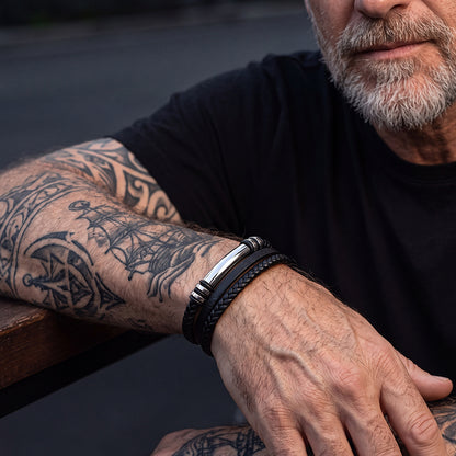 Man wearing custom engraved multi-layered leather bracelet on wrist