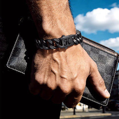 Man wearing Miami Cuban link chain bracelet with custom engraving on wrist