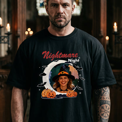A man wearing a black graphic t-shirt with a Halloween design that reads 'Nightmare Night' and features a circular photo.