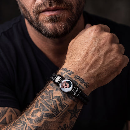 Man wearing custom names photos black braided leather bracelet on wrist