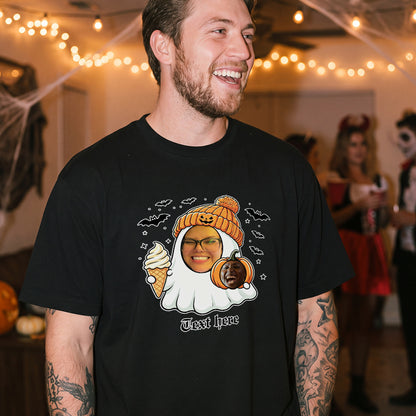 A man wearing a black graphic t-shirt with a Halloween-themed ghost.
