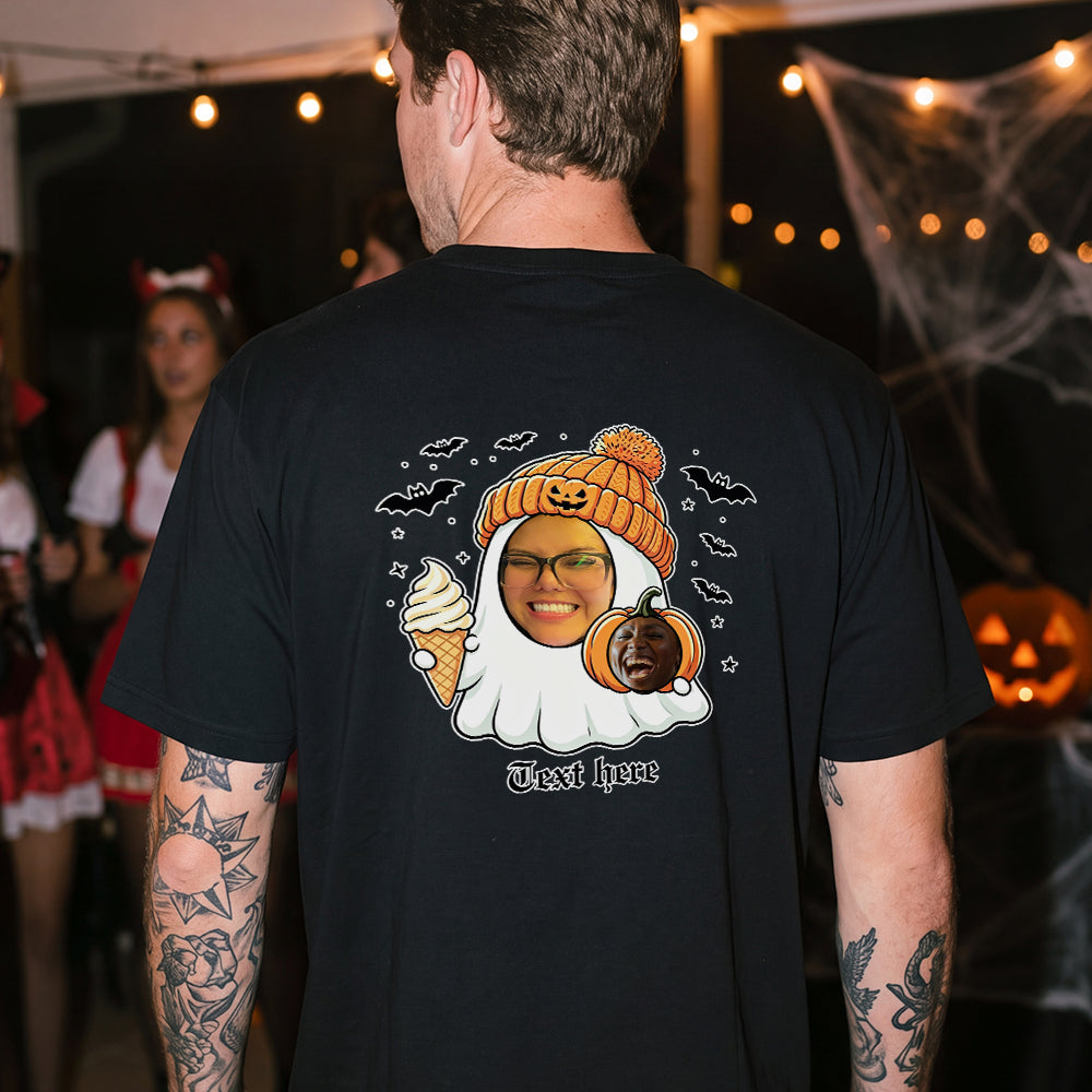 A man viewed from behind wearing a black t-shirt with a large custom graphic on the back. 