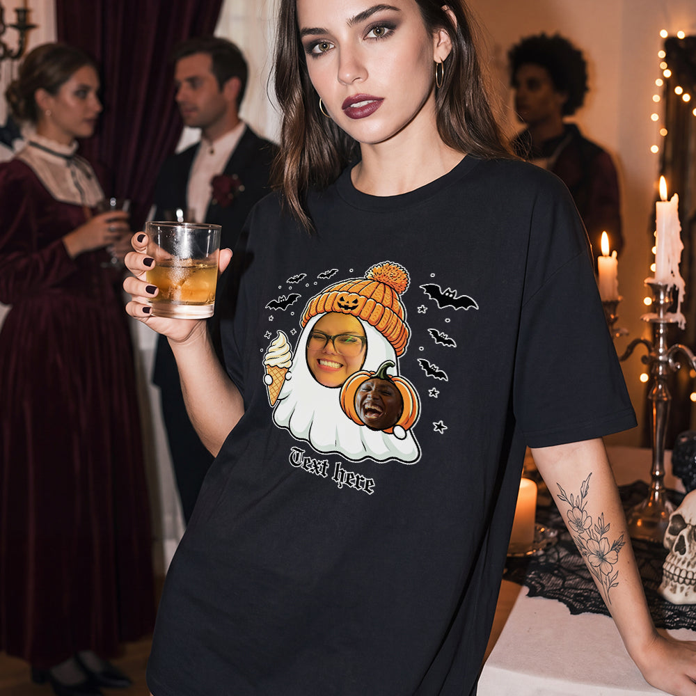A woman at a Halloween party wearing a black graphic t-shirt with a custom ghost face print.