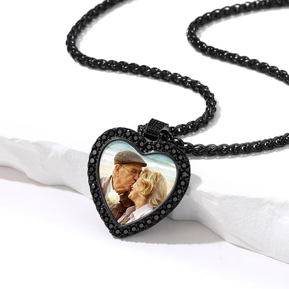 Close-up of heart shaped photo locket pendant with cubic zirconia stones