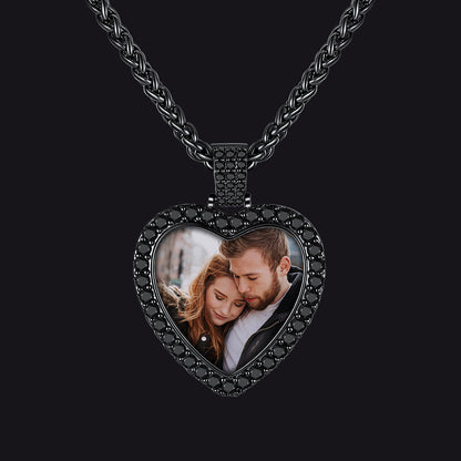 A black heart-shaped photo pendant necklace featuring a custom photo of a couple.