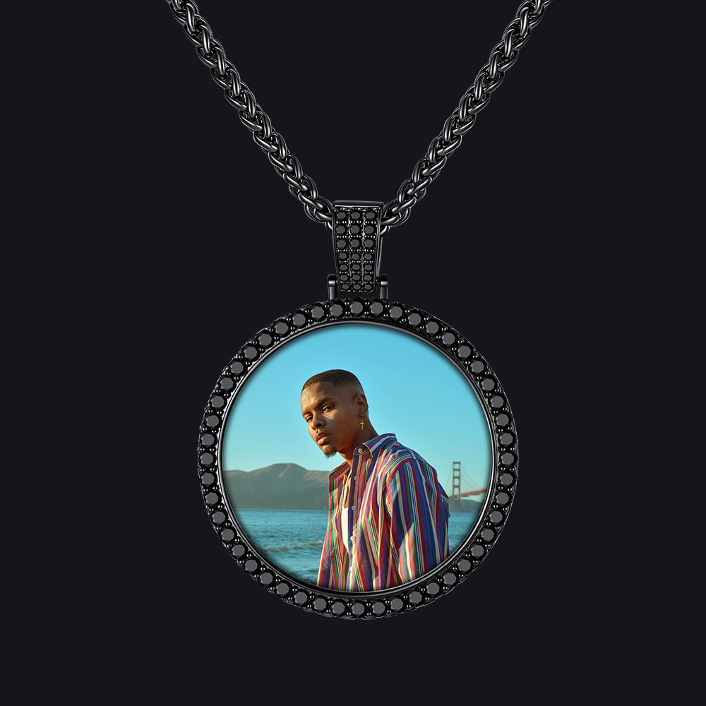 A round pendant necklace featuring a custom photo print of a man in a striped shirt.