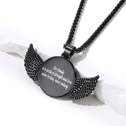 A black metal pendant necklace with engraved white text and wing-shaped side details