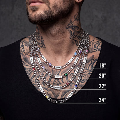 A close-up of a man wearing layered silver chain necklaces with size labels 18", 20", 22", and 24".