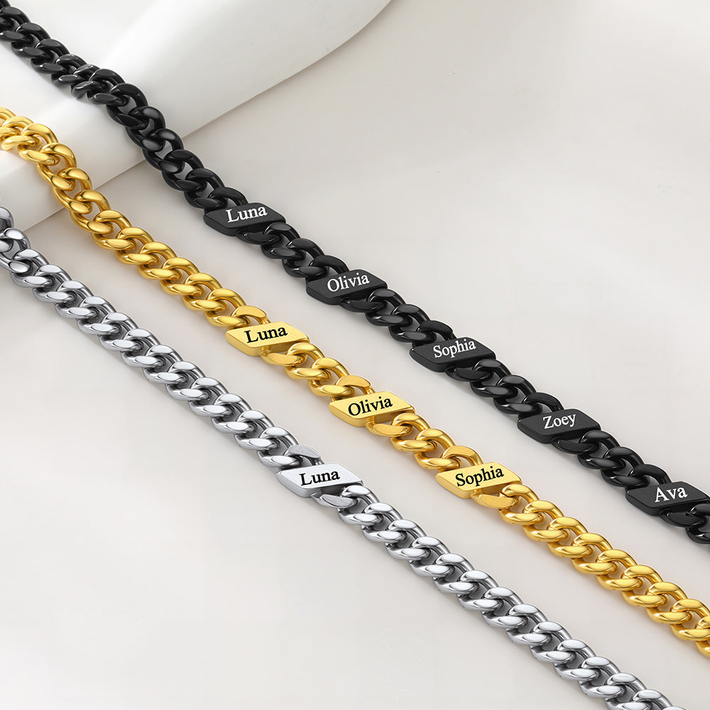 Four chain necklaces in gold, silver, and black with engraved names on a white background