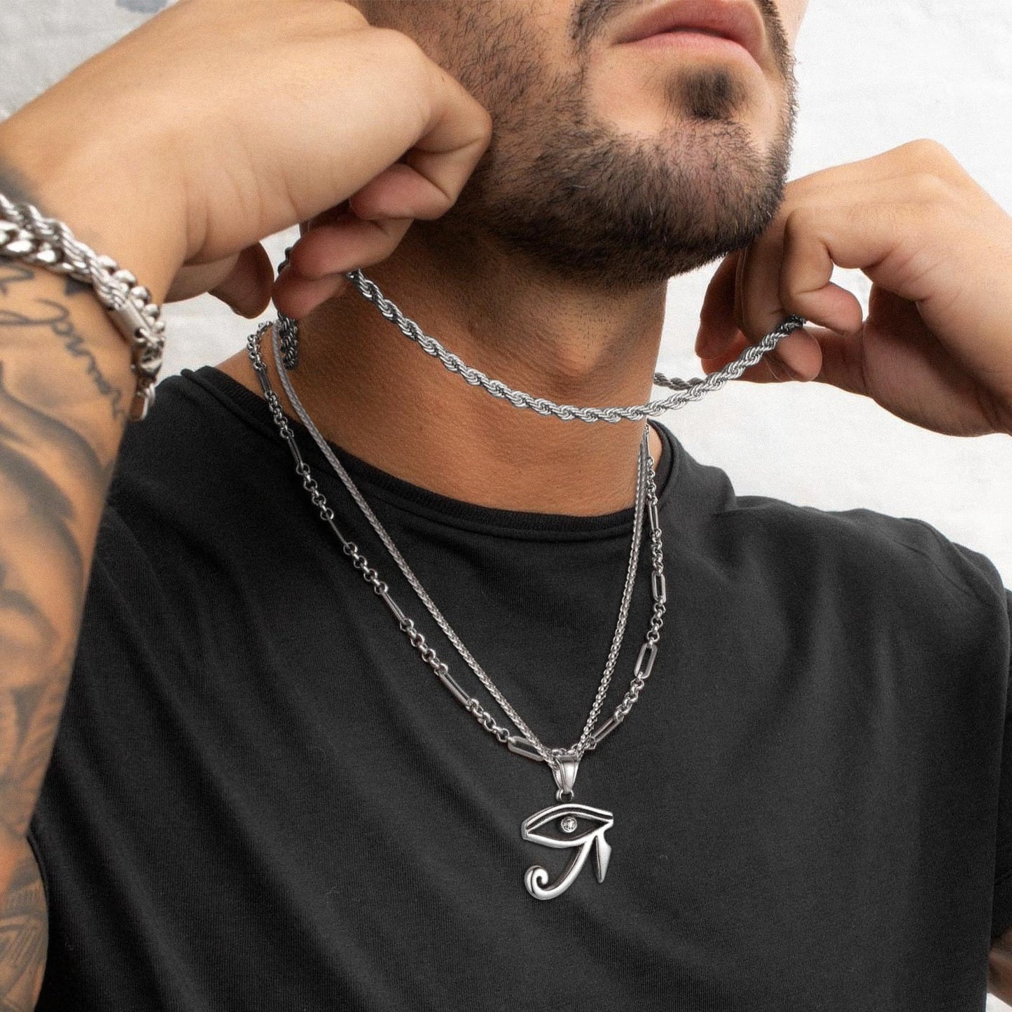 Man wearing Egyptian Eye of Ra necklace