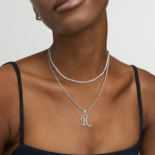 Layered initial necklaces in silver tones for women.img