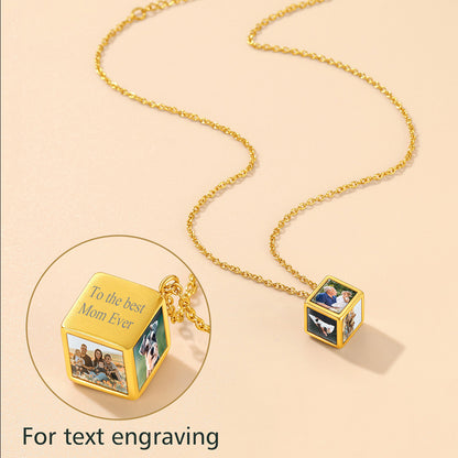 Gold necklace with photo cubes on a beige background