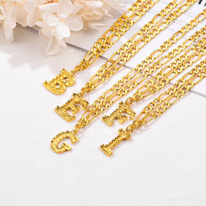 Close-up of stainless steel letter pendant on Figaro chain