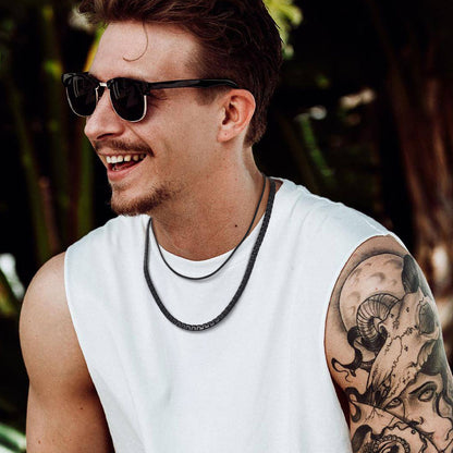 Male model wearing 6mm black flat box chain necklace with casual shirt