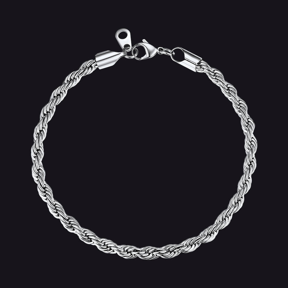 Silver braided bracelet on a black background