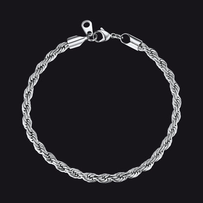 Silver braided bracelet on a black background