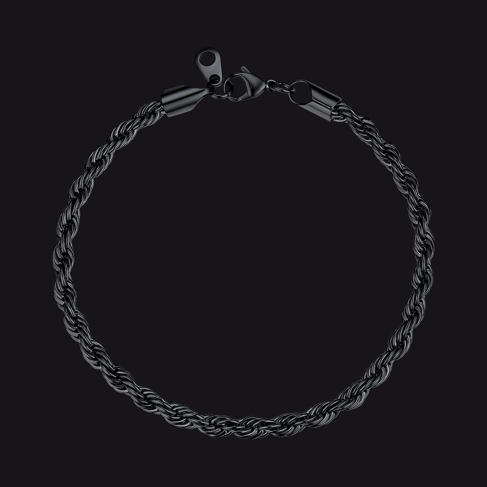 Black braided bracelet on a black background