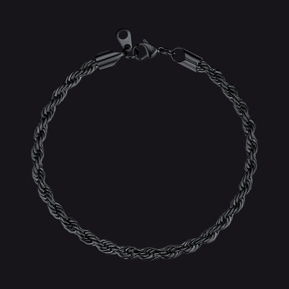 Black braided bracelet on a black background