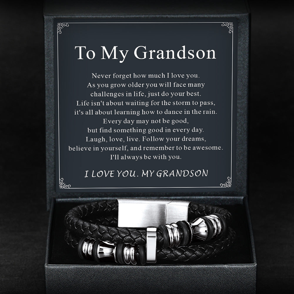Black leather bracelet with silver accents in a box with an engraved message for a grandson.