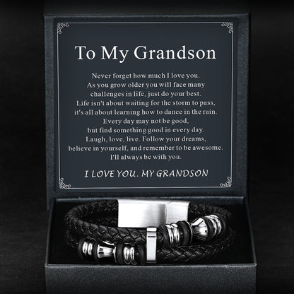 Black leather bracelet with silver accents in a box with an engraved message for a grandson.