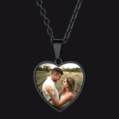 Heart-shaped photo pendant necklace with a couple in a field on a black background