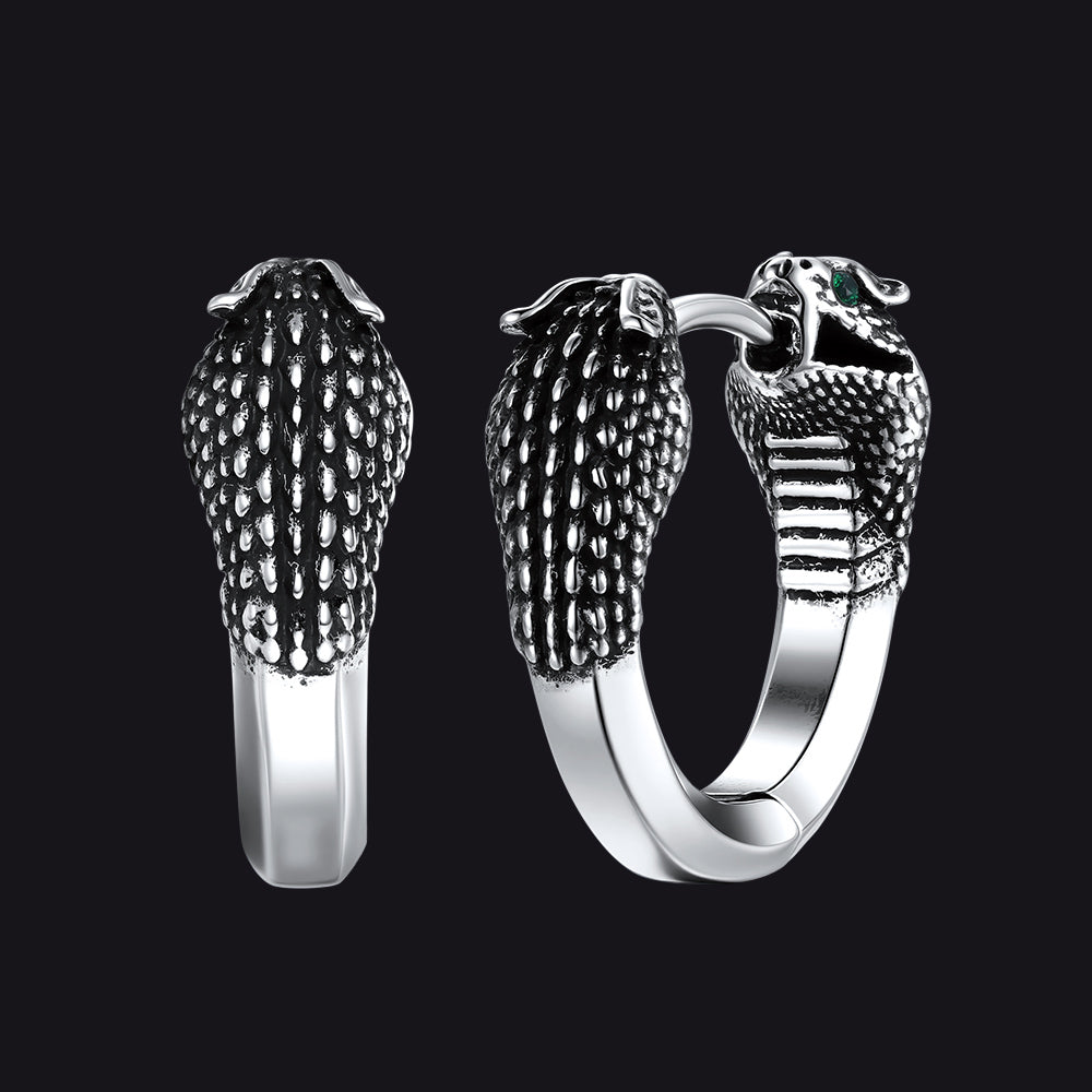 Silver hoop earrings with snake head design on a black background