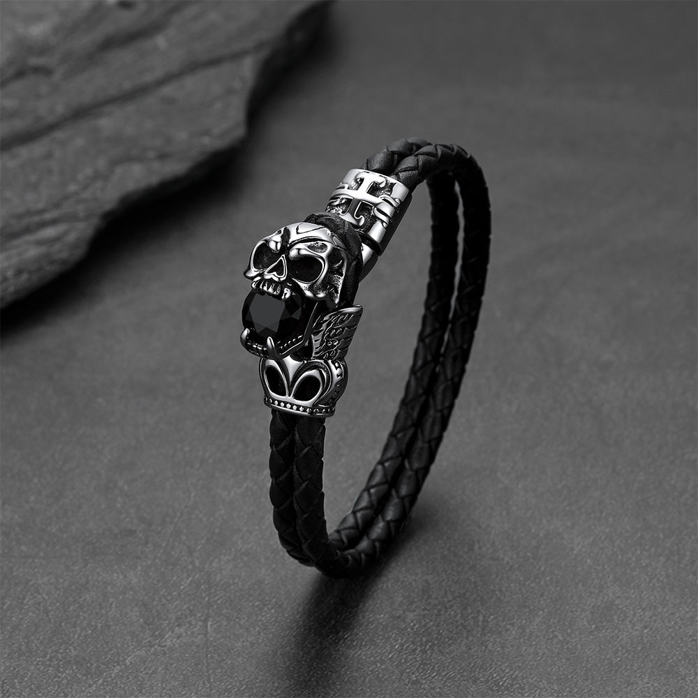 Close-up of vintage skull with crown braided leather