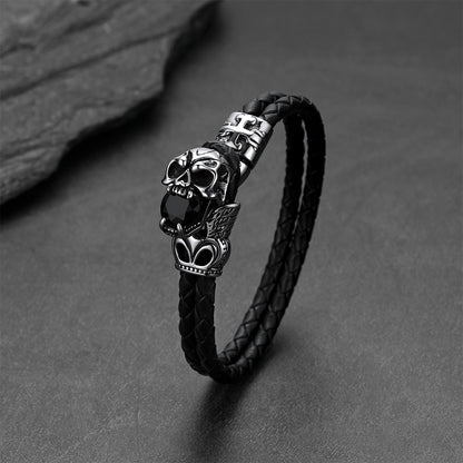 Close-up of vintage skull with crown braided leather